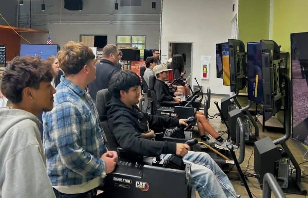 Students at Empower College using Cat Simulators