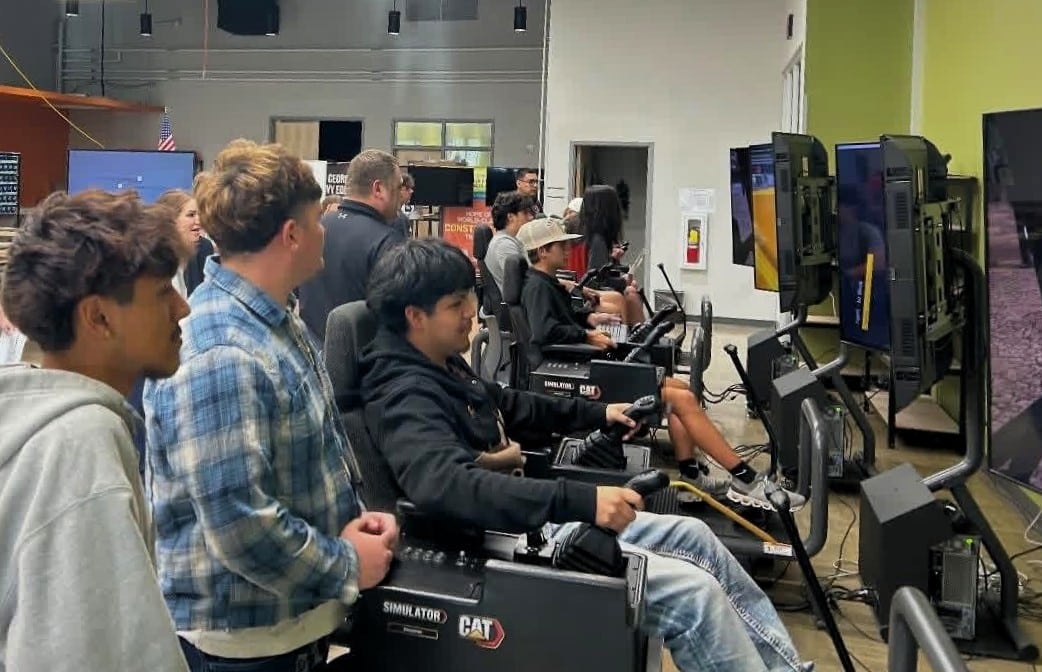 Students at Empower College using Cat Simulators